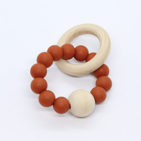 Bijtring met houten kraal