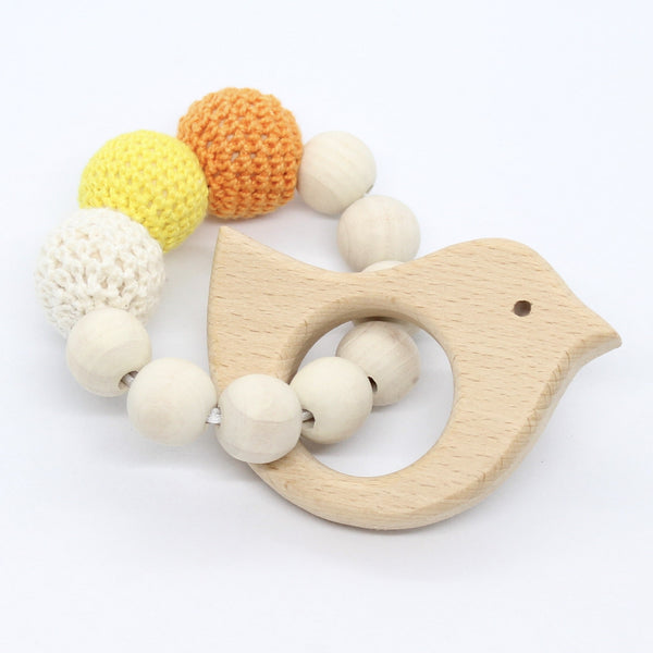 Bijtring met houten figuurtje